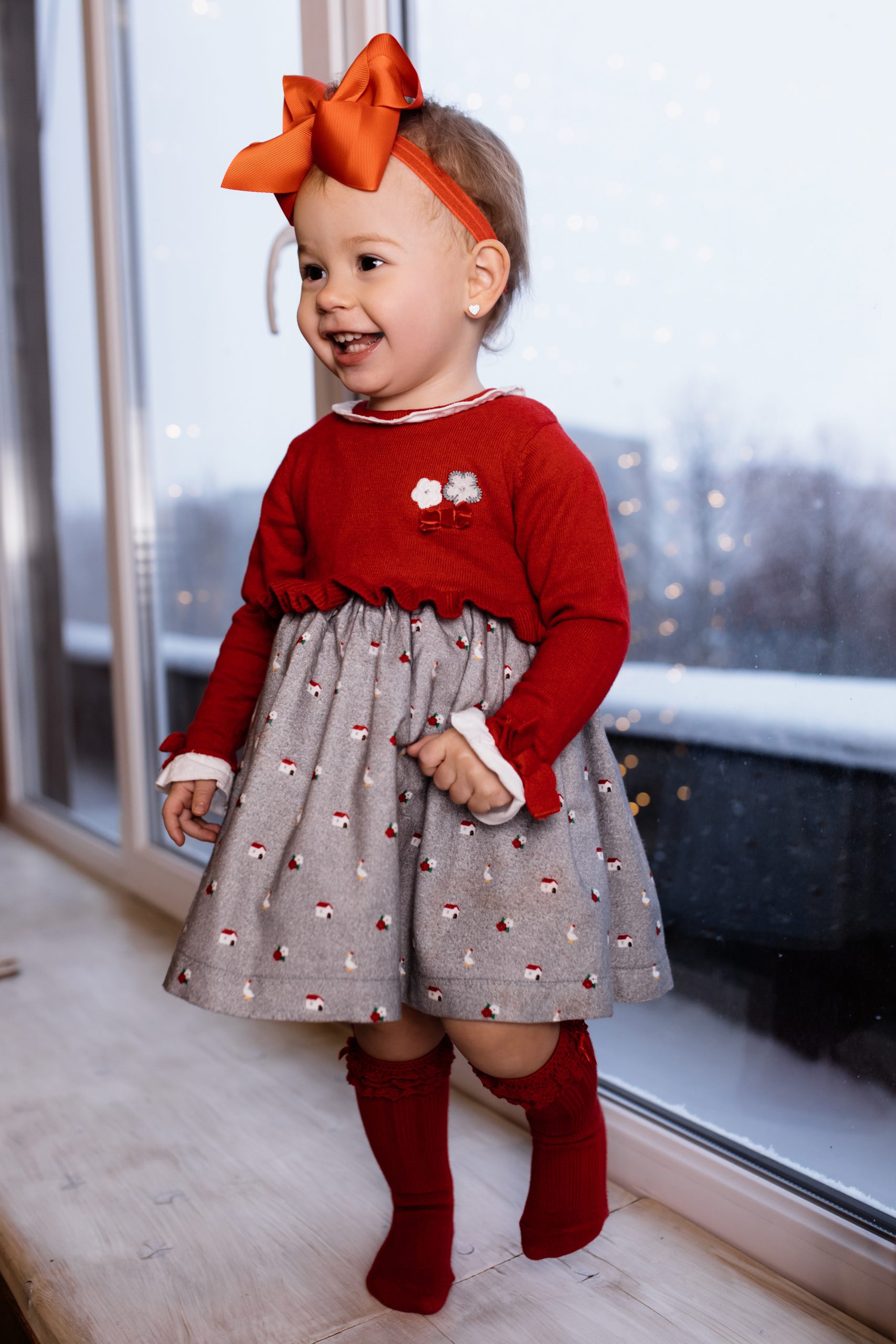 little baby girl staying in room and smiles